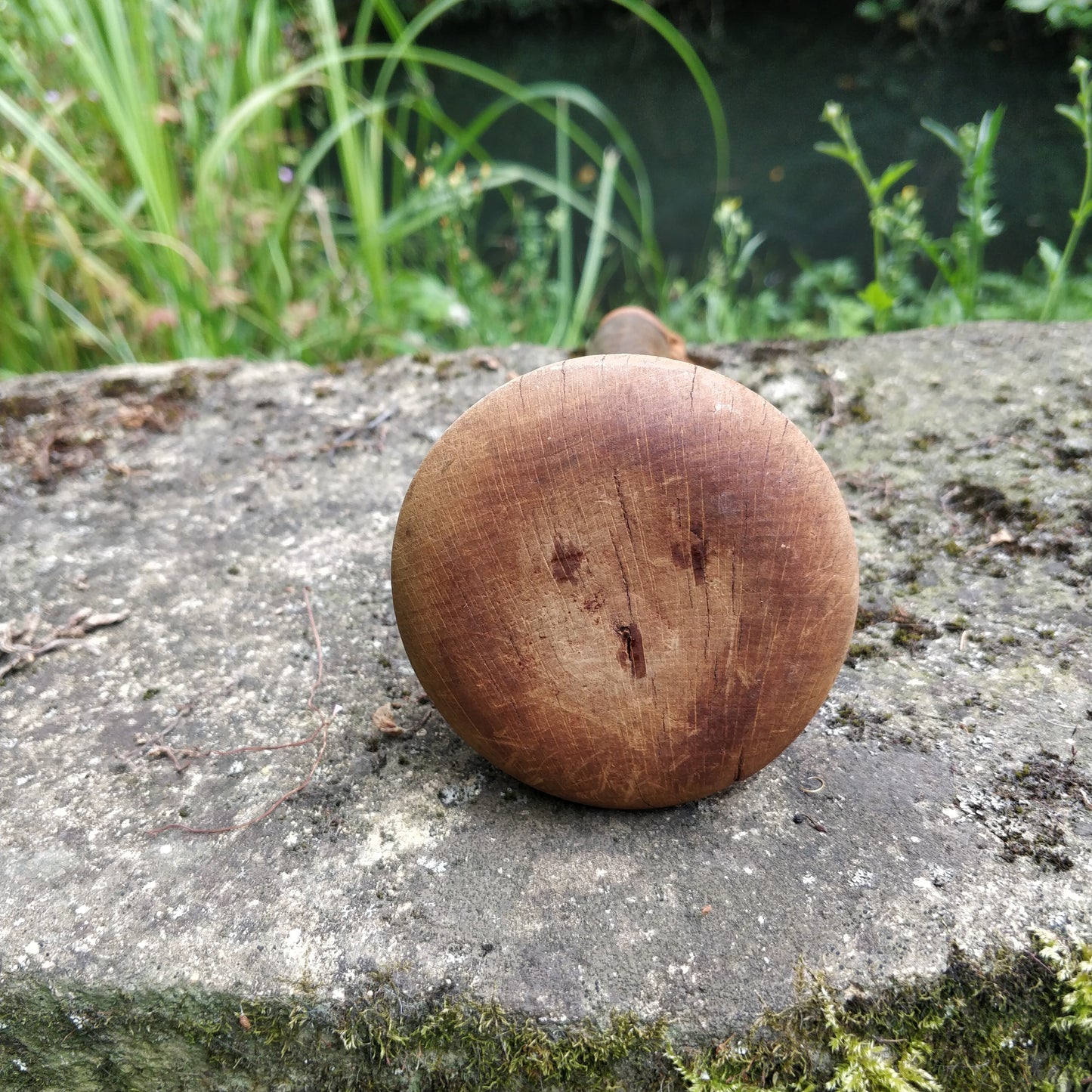 Ancien pilon en bois.