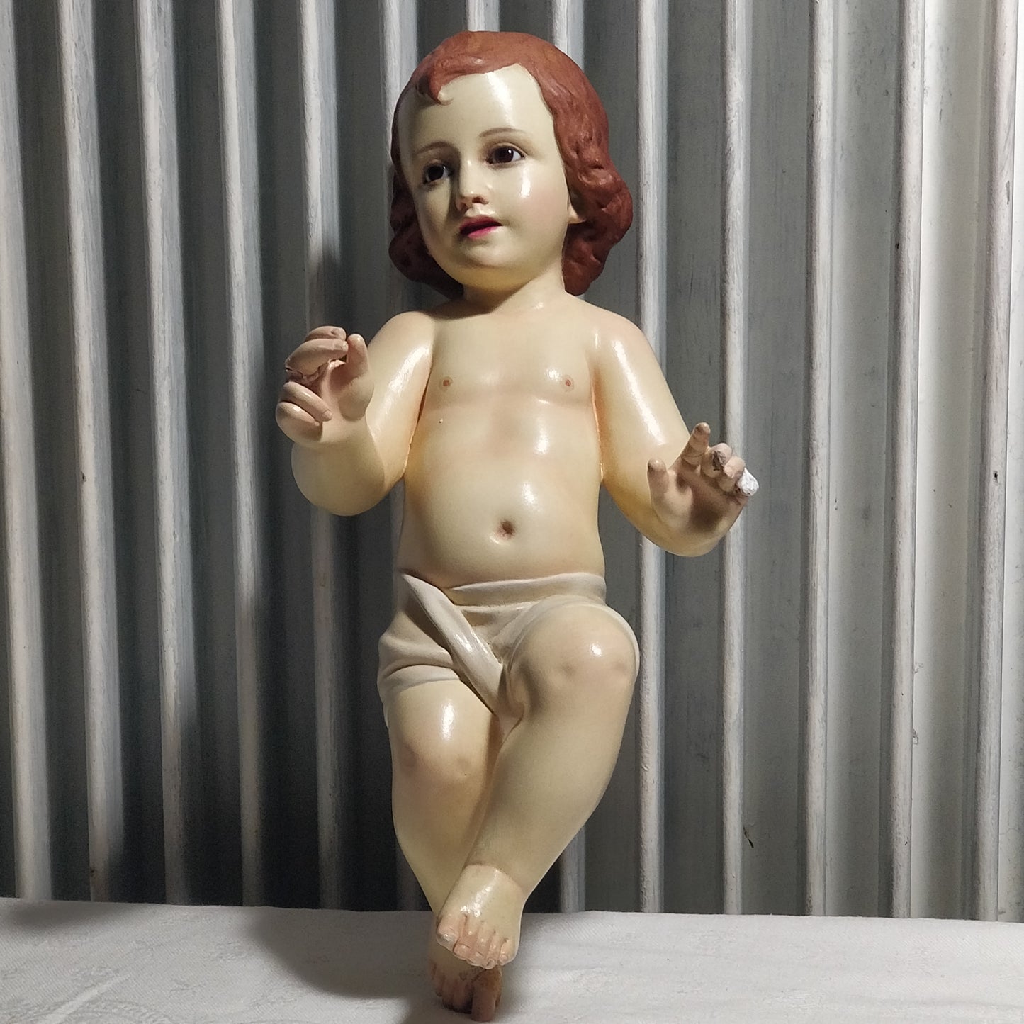 Enfant Jésus plus trois santons pour chrèche.