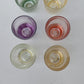 Six verres vintage de différentes couleurs pour liqueur ou digestif.