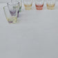 Six verres vintage de différentes couleurs pour liqueur ou digestif.
