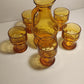 Pichet à jus en verre ambré plus cinq verres ambrés année 70.